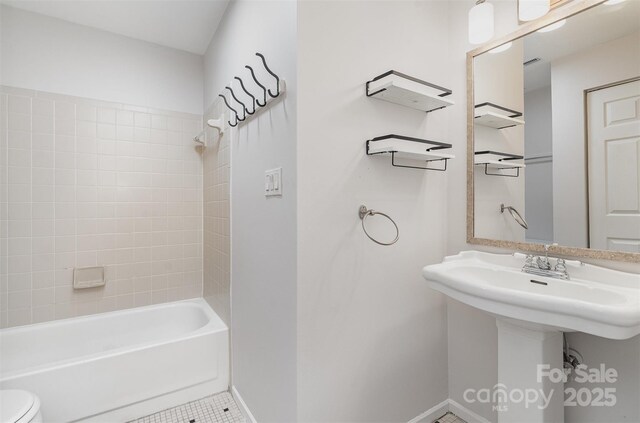 2512 Cranbrook Ln Unit 9, Charlotte, NC 28207 - bathroom with toilet, shower / tub combination, tile patterned floors, baseboards, and a sink