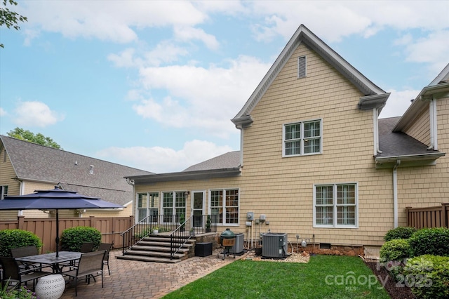 5917 Bridger Ct, Charlotte, NC 28211 - back of house with a patio area, central AC unit, and roof with shingles