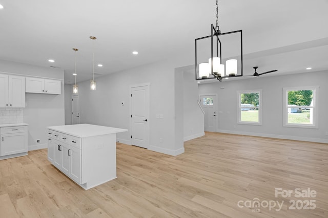 7874 Lucky Creek Ln, Denver, NC 28037 - kitchen with open floor plan, white cabinets, light wood-style flooring, and recessed lighting