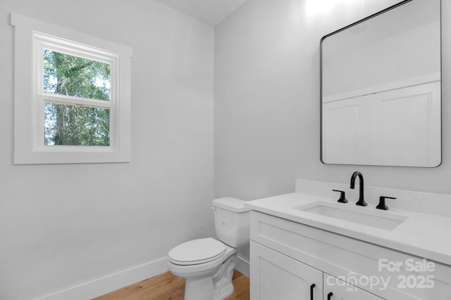 7874 Lucky Creek Ln, Denver, NC 28037 - bathroom featuring vanity, toilet, wood finished floors, and baseboards