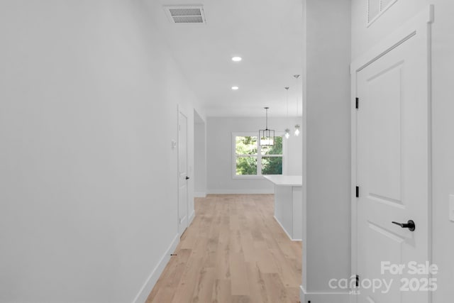 7874 Lucky Creek Ln, Denver, NC 28037 - hall featuring baseboards, light wood-style flooring, recessed lighting, and a chandelier