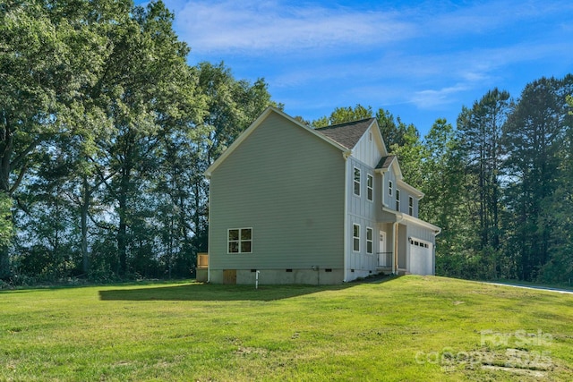 7874 Lucky Creek Ln, Denver, NC 28037 - view of home's exterior featuring board and batten siding, a yard, crawl space, and an attached garage