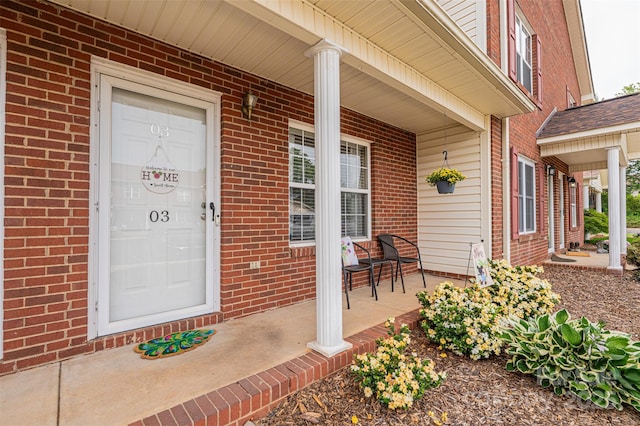 102 Brandywine Dr NE Unit O-3, Conover, NC 28613 - view of exterior entry featuring a porch and brick siding