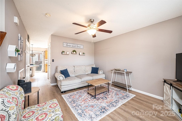 102 Brandywine Dr NE Unit O-3, Conover, NC 28613 - living room featuring light wood-style floors, ceiling fan, and baseboards