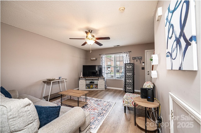 102 Brandywine Dr NE Unit O-3, Conover, NC 28613 - living area featuring ceiling fan, wood finished floors, and baseboards