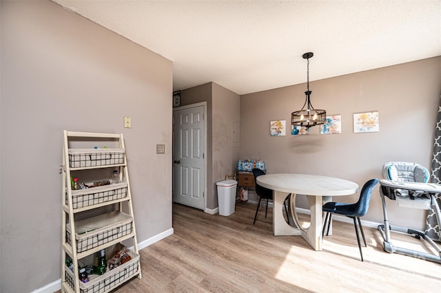 102 Brandywine Dr NE Unit O-3, Conover, NC 28613 - dining room with wood finished floors, baseboards, and a chandelier
