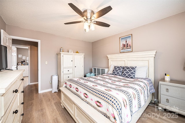 102 Brandywine Dr NE Unit O-3, Conover, NC 28613 - bedroom featuring light wood finished floors, a ceiling fan, and baseboards