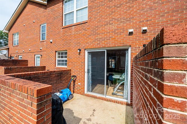 102 Brandywine Dr NE Unit O-3, Conover, NC 28613 - back of house featuring brick siding and a patio area