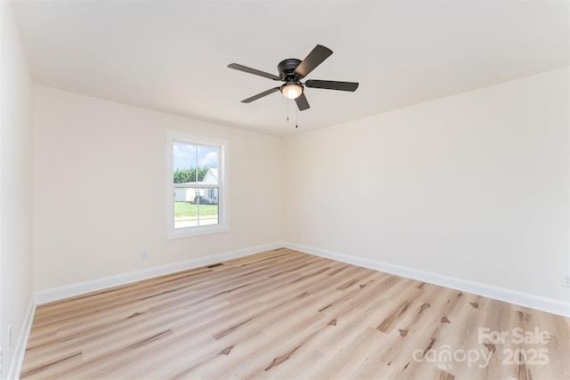 406 N Bostian St, China Grove, NC 28023 - spare room with light wood finished floors, baseboards, and a ceiling fan