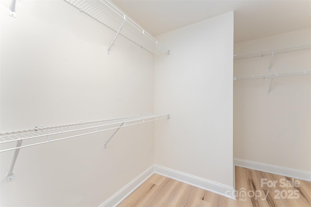 406 N Bostian St, China Grove, NC 28023 - spacious closet with light wood-style floors