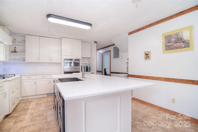 109 Larch Rd, Salisbury, NC 28147 - kitchen featuring open shelves, light countertops, white cabinets, a center island with sink, and stainless steel appliances