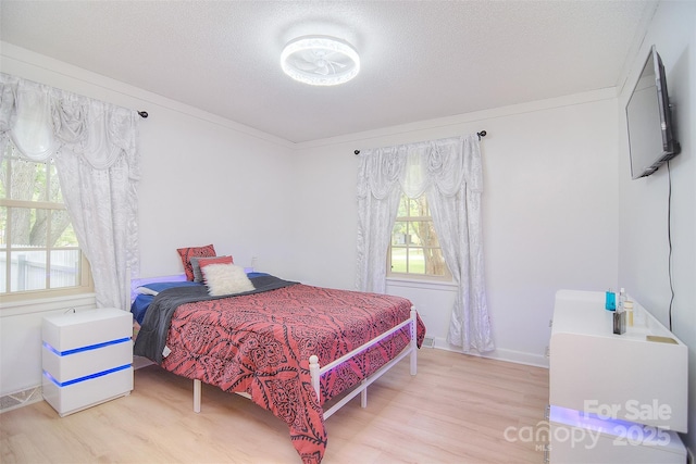 109 Larch Rd, Salisbury, NC 28147 - bedroom featuring wood finished floors and a textured ceiling