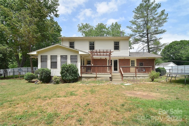 109 Larch Rd, Salisbury, NC 28147 - back of property with a deck, a trampoline, brick siding, and a pergola