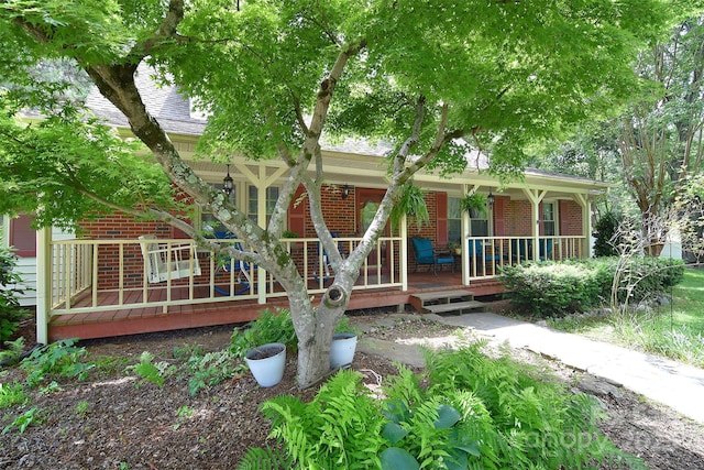 109 Larch Rd, Salisbury, NC 28147 - view of front of house featuring covered porch, brick siding, and a shingled roof