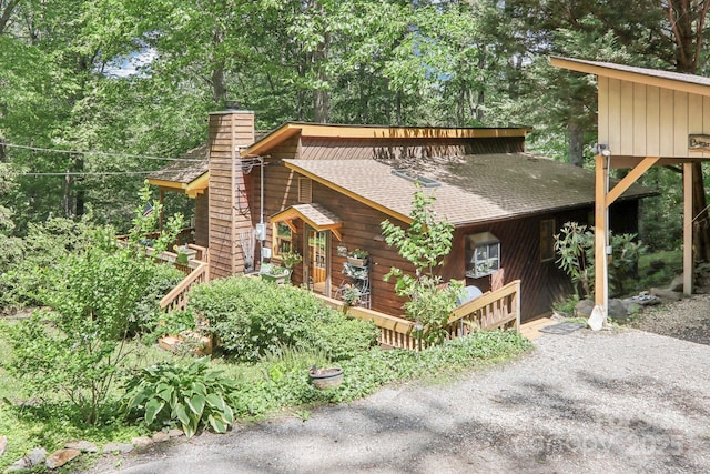 46 Thrush Dr, Maggie Valley, NC 28751 - view of side of property with a shingled roof and a chimney