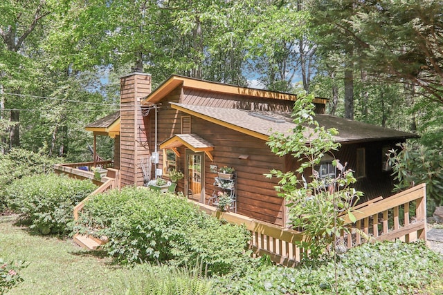 46 Thrush Dr, Maggie Valley, NC 28751 - view of front of property with a shingled roof and a chimney