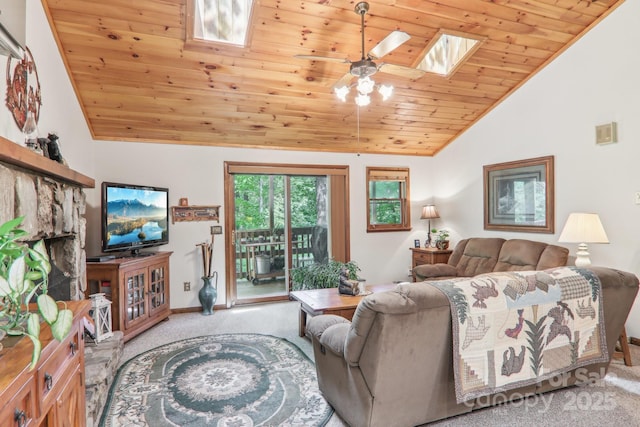 46 Thrush Dr, Maggie Valley, NC 28751 - carpeted living area featuring a skylight, vaulted ceiling, wooden ceiling, ceiling fan, and baseboards