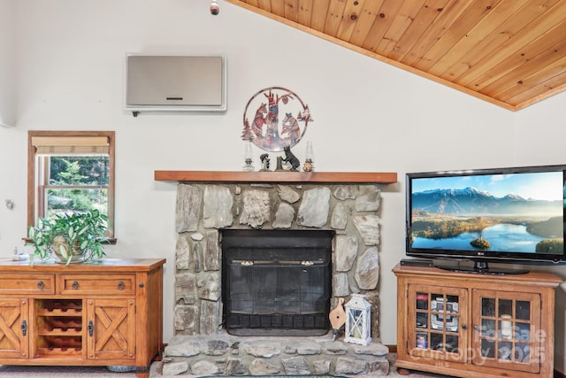 46 Thrush Dr, Maggie Valley, NC 28751 - living area with a wall mounted air conditioner, lofted ceiling, wood ceiling, crown molding, and a stone fireplace
