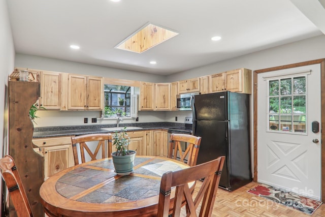 46 Thrush Dr, Maggie Valley, NC 28751 - kitchen featuring appliances with stainless steel finishes, light brown cabinets, a sink, healthy amount of natural light, and recessed lighting