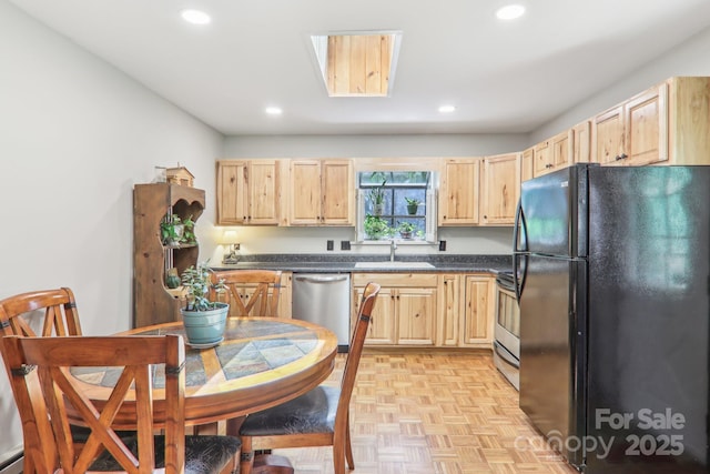 46 Thrush Dr, Maggie Valley, NC 28751 - kitchen with appliances with stainless steel finishes, light brown cabinetry, a sink, dark countertops, and recessed lighting
