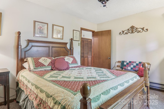 46 Thrush Dr, Maggie Valley, NC 28751 - bedroom featuring carpet floors, a textured ceiling, and a baseboard radiator