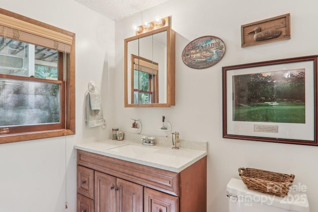 46 Thrush Dr, Maggie Valley, NC 28751 - bathroom featuring vanity, a textured ceiling, and toilet