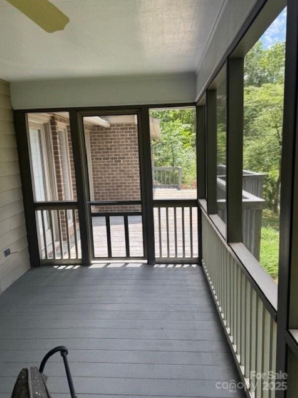 240 Goshen Ter, Wilkesboro, NC 28697 - unfurnished sunroom with a ceiling fan and healthy amount of natural light