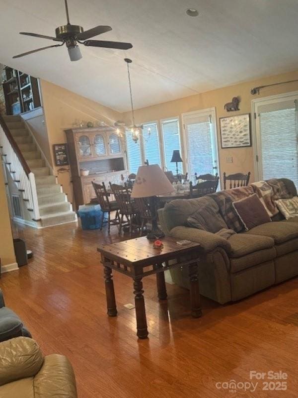 240 Goshen Ter, Wilkesboro, NC 28697 - living room featuring ceiling fan, wood finished floors, plenty of natural light, and stairway