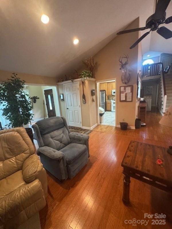 240 Goshen Ter, Wilkesboro, NC 28697 - living room featuring a ceiling fan, wood finished floors, recessed lighting, high vaulted ceiling, and baseboards
