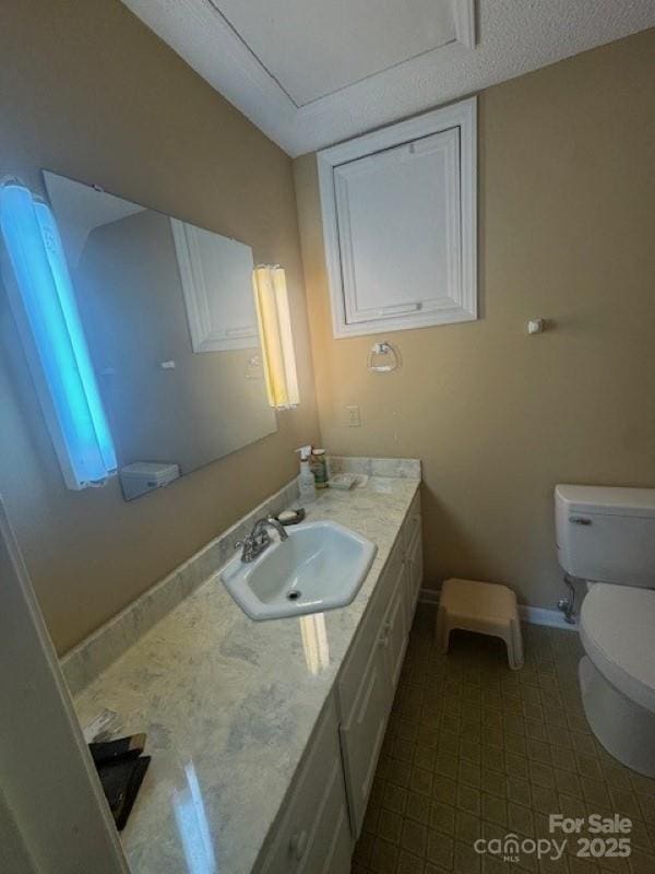 240 Goshen Ter, Wilkesboro, NC 28697 - half bathroom featuring toilet, vanity, baseboards, and tile patterned floors