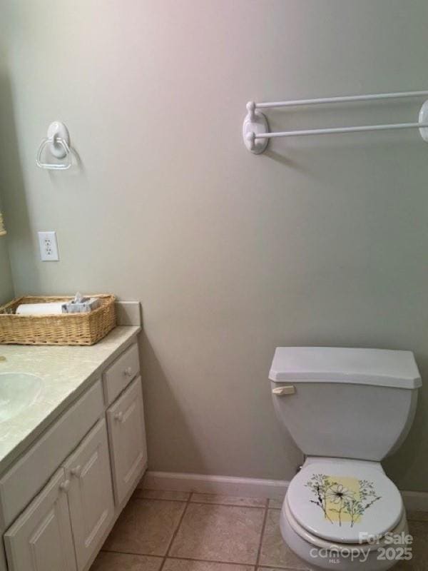 240 Goshen Ter, Wilkesboro, NC 28697 - bathroom featuring toilet, baseboards, vanity, and tile patterned flooring