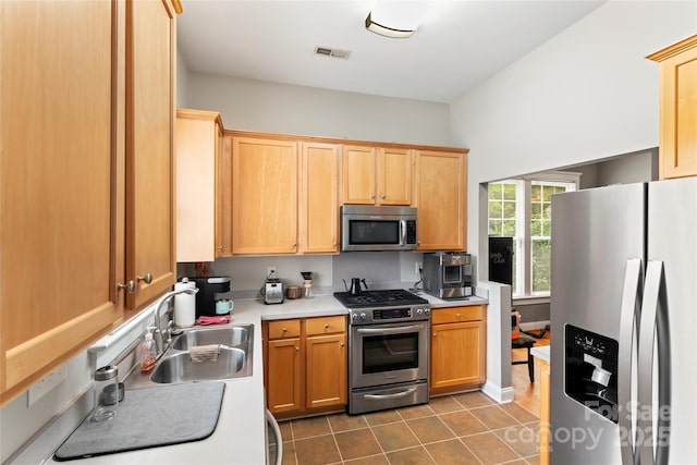 3007 Colonel Springs Way, Fort Mill, SC 29708 - kitchen with stainless steel appliances, a sink, light countertops, tile patterned flooring, and light brown cabinets