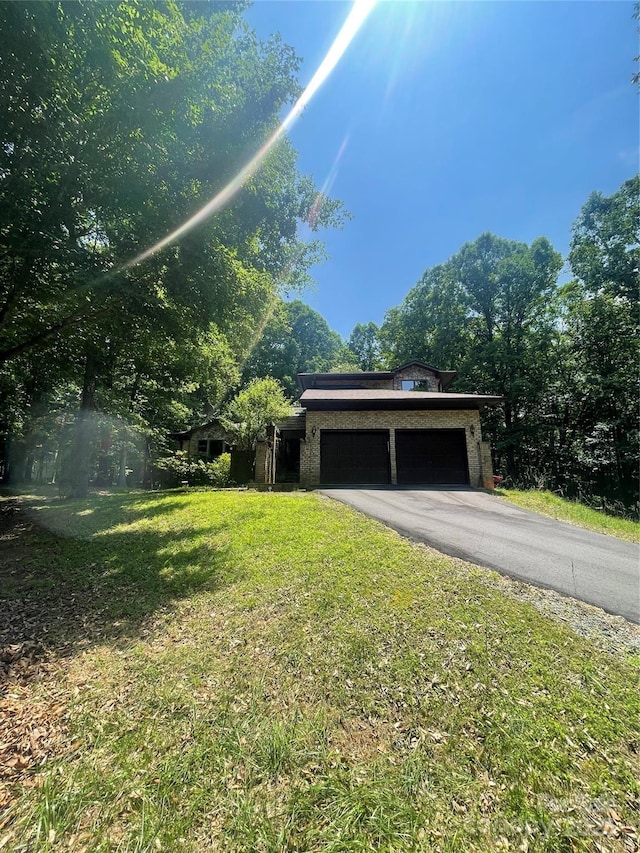 2505 White Thorne Ln, Waxhaw, NC 28173 - view of property exterior with a garage, a lawn, and driveway