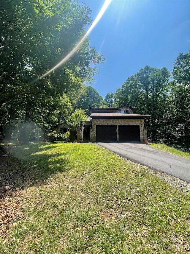 2505 White Thorne Ln, Waxhaw, NC 28173 - view of grassy yard featuring a garage and driveway