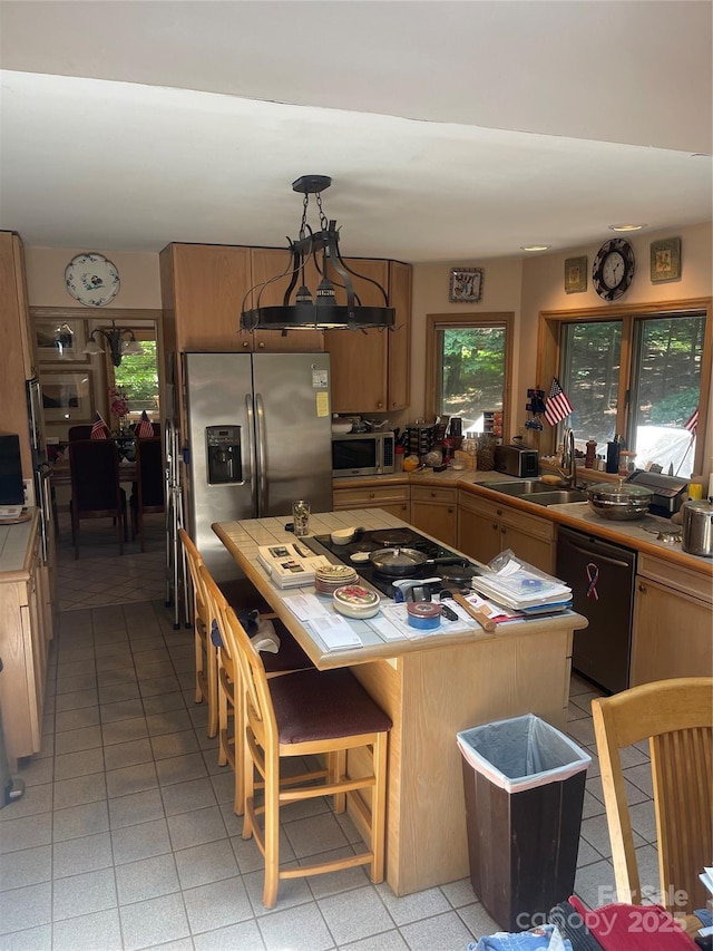 2505 White Thorne Ln, Waxhaw, NC 28173 - kitchen with stainless steel appliances, tile counters, a sink, and light tile patterned flooring