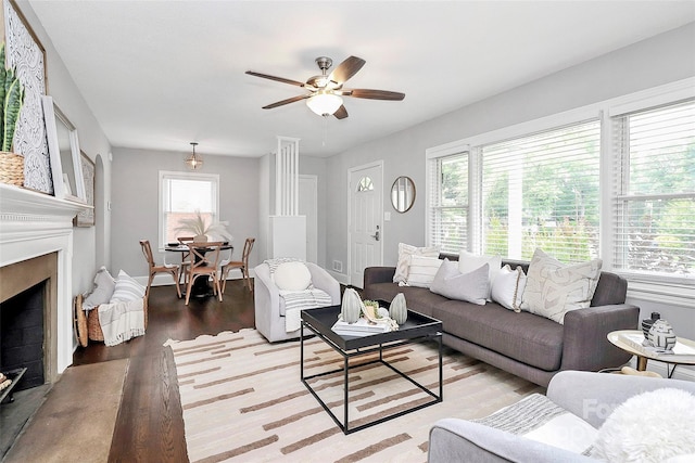 2421 Shamrock Dr, Charlotte, NC 28205 - living room with light wood finished floors, a fireplace, and a ceiling fan