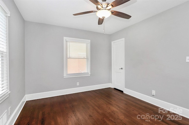 2421 Shamrock Dr, Charlotte, NC 28205 - spare room featuring dark wood finished floors, baseboards, and a ceiling fan