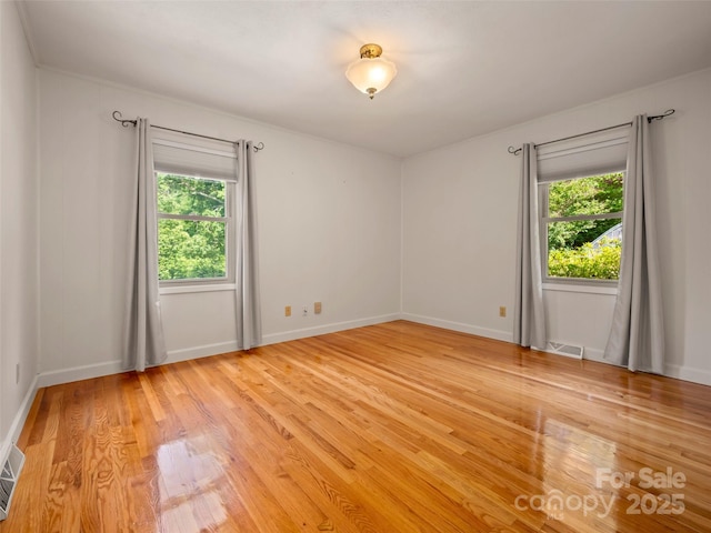 418 Mountain Page Rd, Saluda, NC 28773 - unfurnished room with light wood finished floors and baseboards