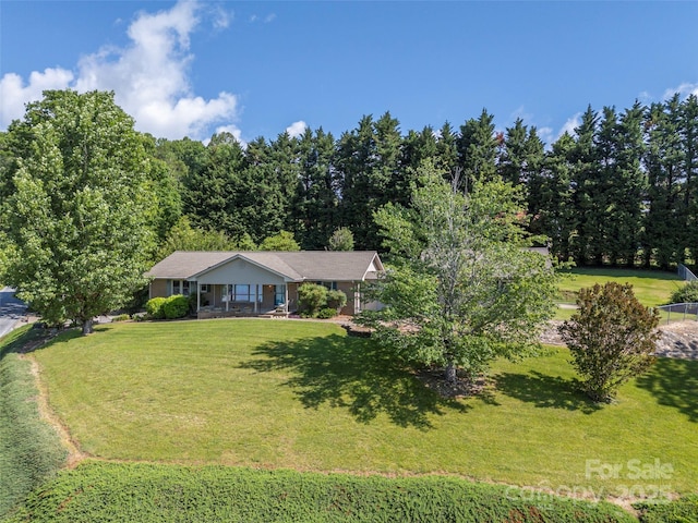 418 Mountain Page Rd, Saluda, NC 28773 - view of front of home featuring a front lawn and a porch