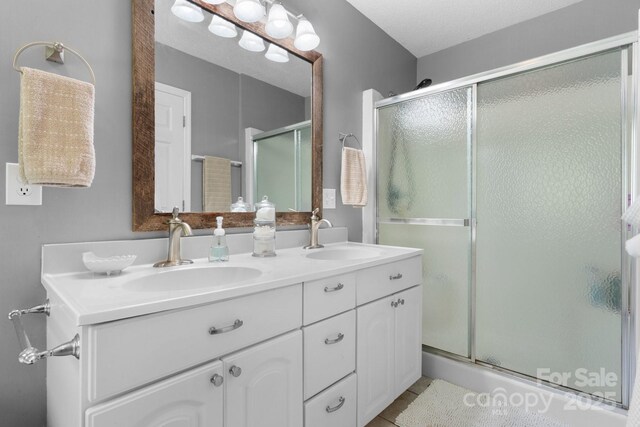1321 Birch Dr, Morganton, NC 28655 - full bathroom featuring a shower stall, double vanity, and tile patterned floors