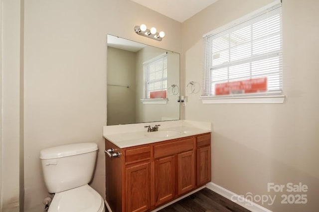 2599 April Showers Ln, Rock Hill, SC 29730 - bathroom with toilet, vanity, wood finished floors, and baseboards