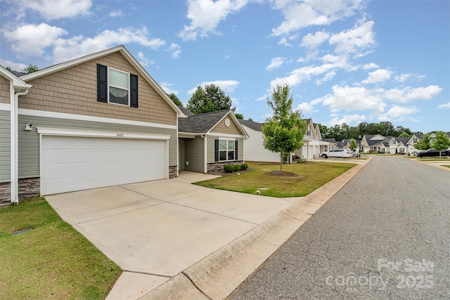 1405 Amberlight Cir, Salisbury, NC 28144 - view of front of property with stone siding, a garage, driveway, and a front yard