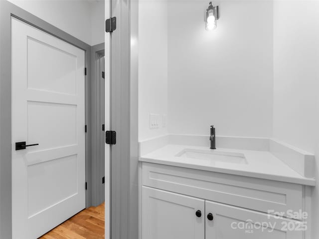314 Gallimore Rd Unit 1, Brevard, NC 28712 - bathroom with vanity and wood finished floors