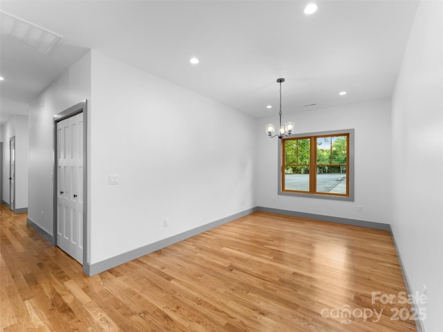 314 Gallimore Rd Unit 1, Brevard, NC 28712 - unfurnished room with light wood-type flooring, recessed lighting, baseboards, and a chandelier