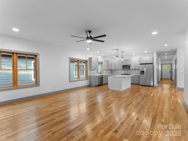 314 Gallimore Rd Unit 1, Brevard, NC 28712 - unfurnished living room featuring recessed lighting, healthy amount of natural light, ceiling fan, light wood-style floors, and baseboards