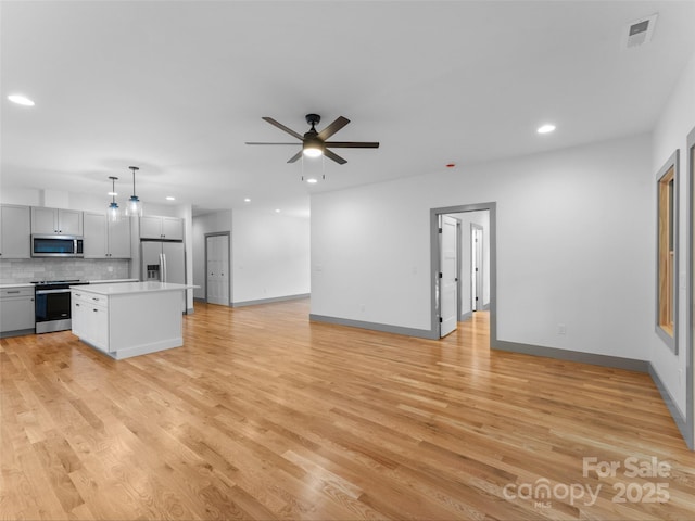 314 Gallimore Rd Unit 1, Brevard, NC 28712 - unfurnished living room with recessed lighting, a ceiling fan, light wood-type flooring, and baseboards
