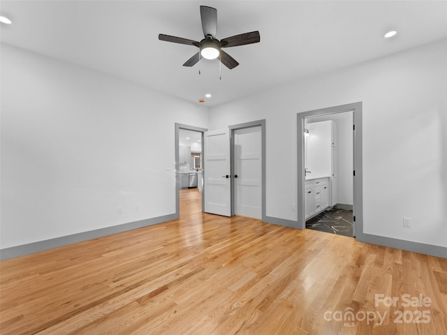314 Gallimore Rd Unit 1, Brevard, NC 28712 - unfurnished bedroom featuring wood finished floors, recessed lighting, baseboards, ensuite bath, and a ceiling fan