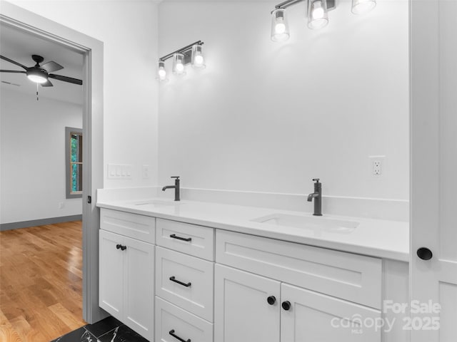 314 Gallimore Rd Unit 1, Brevard, NC 28712 - bathroom with ceiling fan, double vanity, wood finished floors, and baseboards
