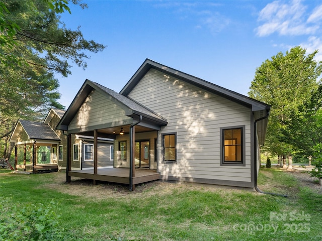 314 Gallimore Rd Unit 1, Brevard, NC 28712 - rear view of house with a wooden deck and a lawn
