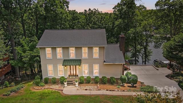 29049 Snapper Pt, Tega Cay, SC 29708 - colonial house featuring a chimney and driveway